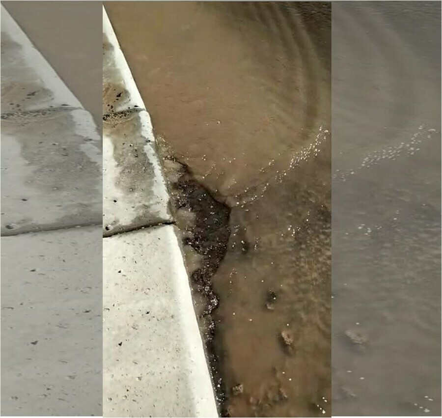 В Благовещенске вода изпод свежеуложенного асфальта стремительно топит улицу Горького фотовидео